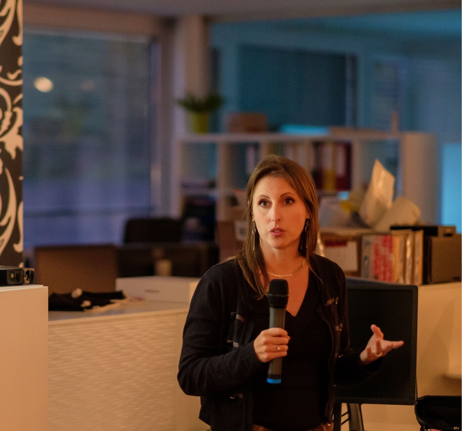 Dr. Michaela Greiler speaking at a software engineering event